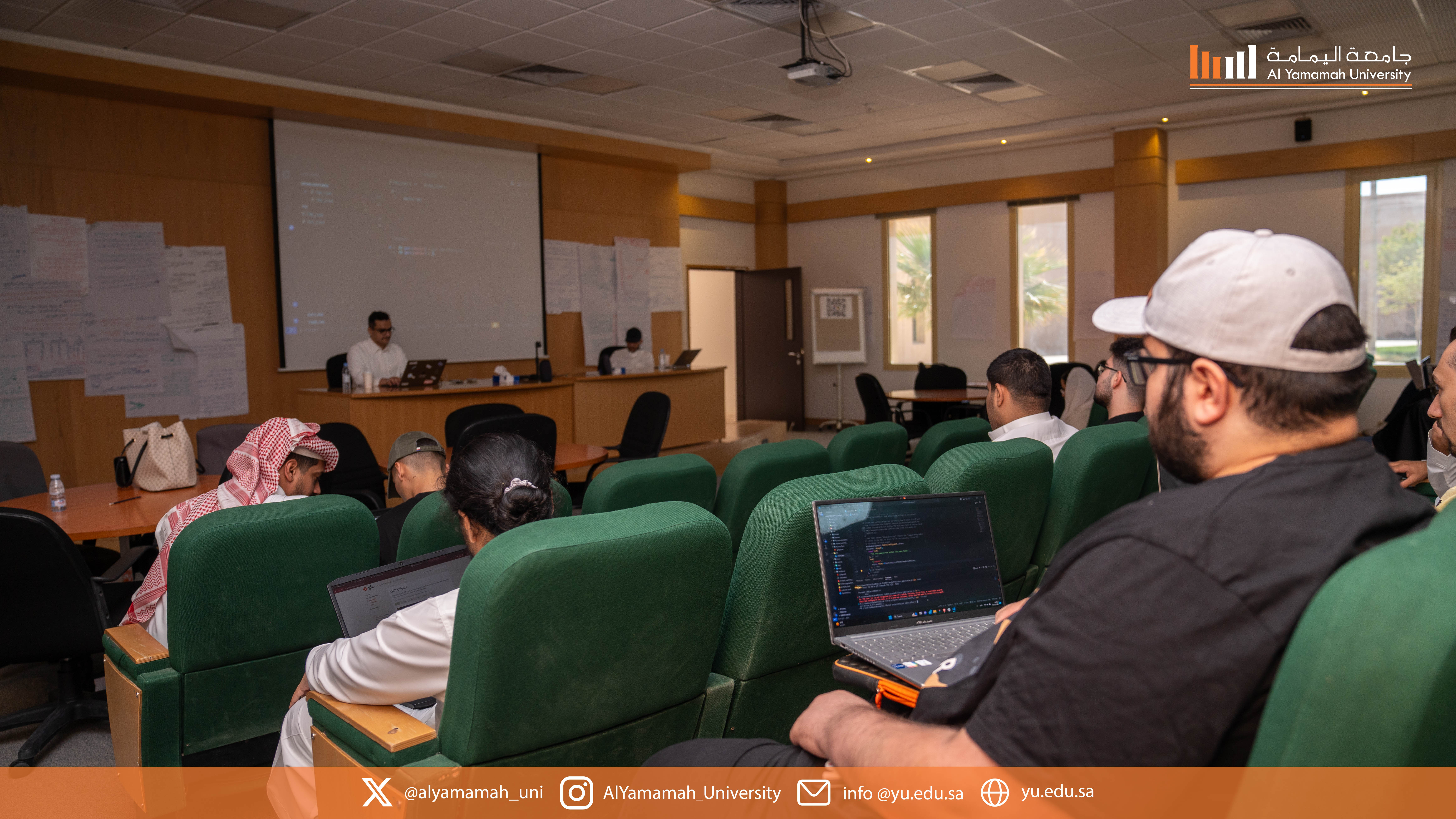 Participants attentively listening to the presenter during the workshop